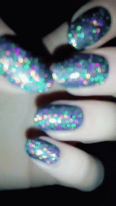 Woman's Nails With Blue And Green Glitter GIF