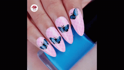 Woman's Pink Nails With Blue Butterflies And Nail Polish GIF