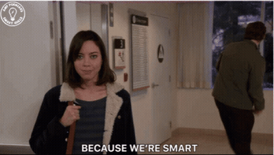 Woman Saying Because We're Smart With Man Behind GIF