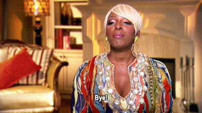 Woman Saying Bye In Living Room GIF