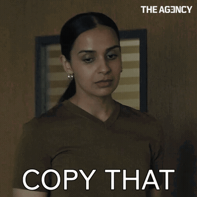 Woman Saying Copy That In Front Of Wall GIF