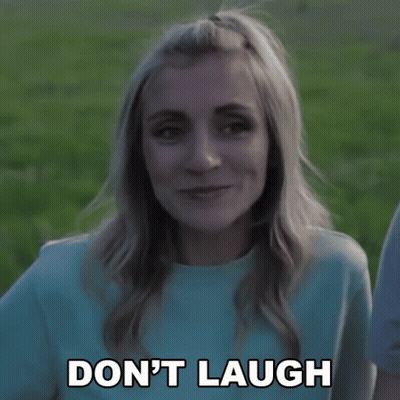 Woman Saying Don't Laugh In Blue Shirt GIF