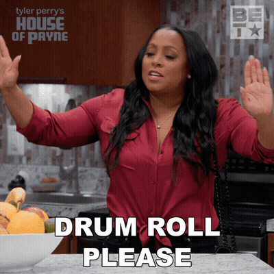 Woman Saying Drum Roll Please GIF
