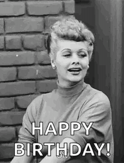 Woman Saying Happy Birthday By Brick Wall GIF