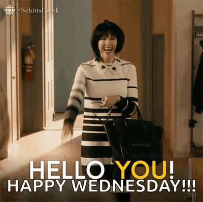 Woman Saying Hello You Happy Wednesday With Black Purse GIF