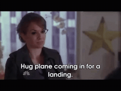 Woman Saying Hug Plane Coming In For A Landing GIF