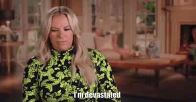 Woman Saying I Am Devastated In Front Of Moonshine Ad GIF