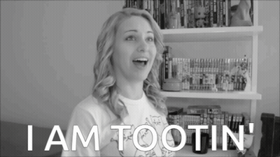 Woman Saying I Am Tootin In Front Of Bookshelf GIF