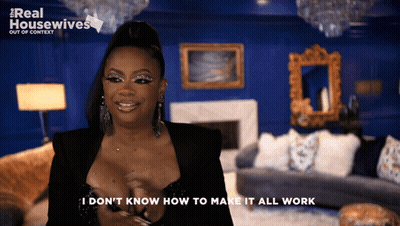 Woman Saying I Don't Know Blue Wall GIF