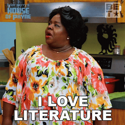 Woman Saying I Love Literature In Kitchen GIF