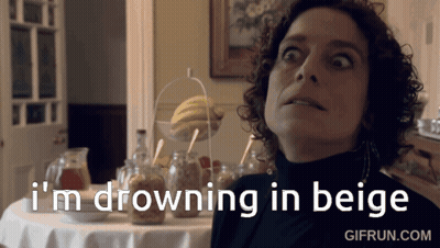 Woman Saying I'm Drowning In Beige At Table With Jars GIF