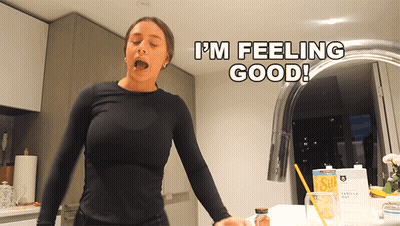 Woman Saying I'm Feeling Good In Front Of Sink GIF