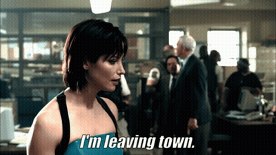 Woman Saying I'm Leaving Town In Front Of Group GIF