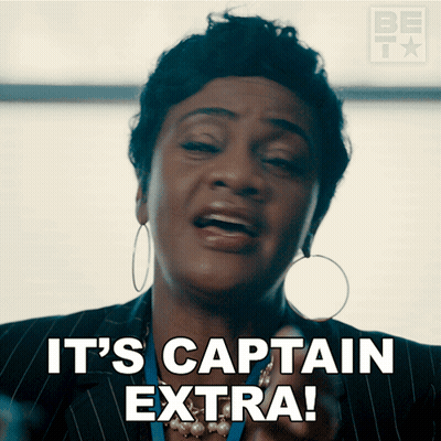 Woman Saying It's Captain Extra With Hoop Earrings GIF