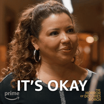 Woman Saying It's Okay In Front Of Picture GIF