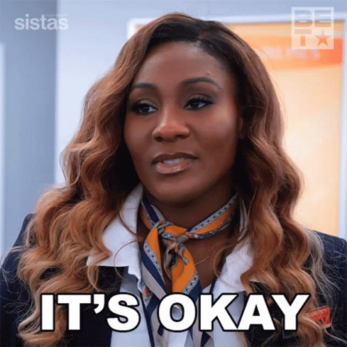 Woman Saying It's Okay In Scarf And Suit GIF
