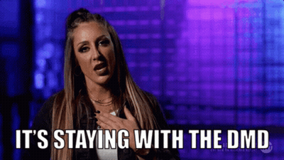 Woman Saying It's Staying With The DMD Holding Chest GIF
