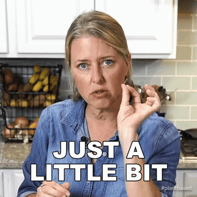 Woman Saying Just A Little Bit Beside Bananas GIF
