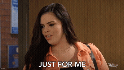 Woman Saying Just For Me By Brick Wall GIF
