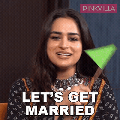 Woman Saying Let's Get Married Holding Green Object GIF
