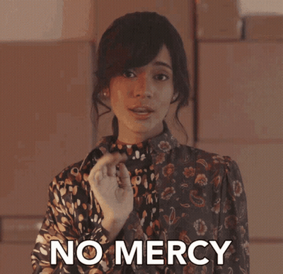 Woman Saying No Mercy In Front Of Boxes GIF