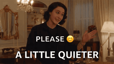 Woman Saying Please A Little Quieter In Front Of Chandelier GIF