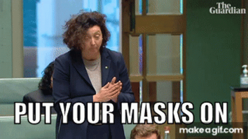 Woman Saying Put Your Masks On To Group GIF