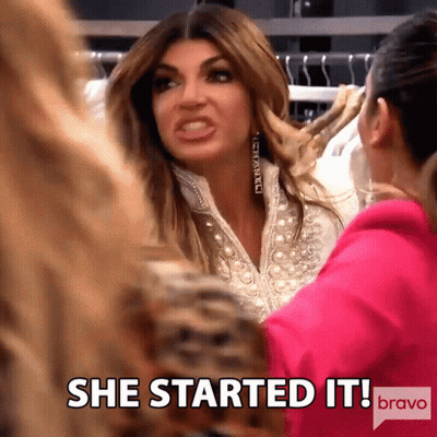 Woman Saying She Started It Beside Pink Jacket GIF