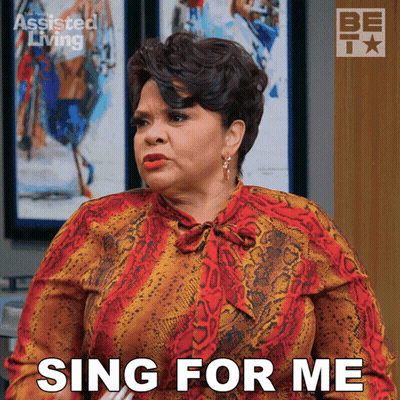 Woman Saying Sing For Me In Front Of Be TV Logo GIF