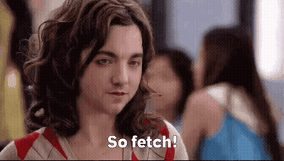 Woman Saying So Fetch In Front Of Group GIF