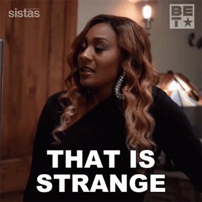 Woman Saying That Is Strange By Lamp GIF