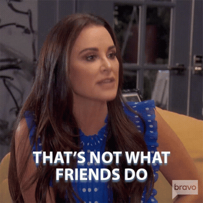 Woman Saying That's Not What Friends Do Sitting On Couch GIF
