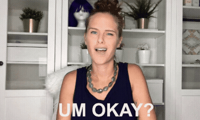 Woman Saying Um Okay In Front Of Shelves GIF