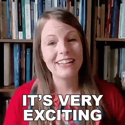 Woman Saying Very Exciting At Bookcase GIF