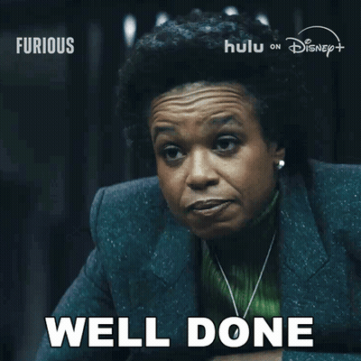 Woman Saying Well Done In Front Of Disney Poster GIF