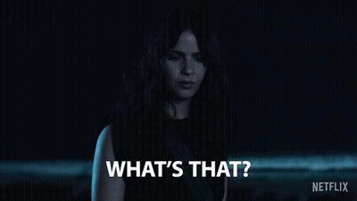 Woman Saying What's That In Dark Room GIF