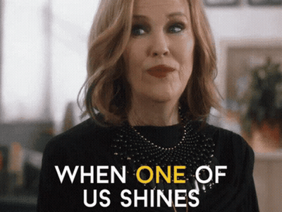 Woman Saying When One Shines In Black Top GIF