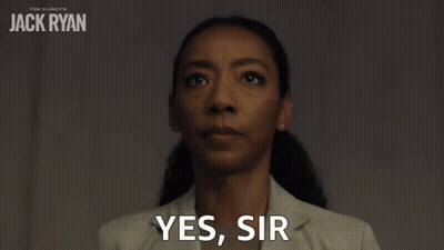 Woman Saying Yes Sir Beside Jack Ryan Poster GIF