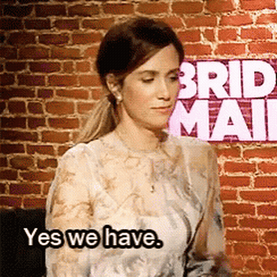 Woman Saying Yes We Have In Front Of Bride Mail Sign GIF
