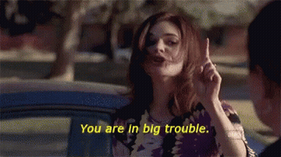 Woman Saying You Are In Big Trouble While Pointing Up GIF