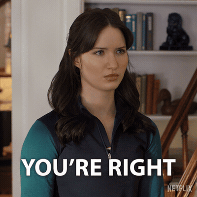 Woman Saying You're Right In Front Of Bookshelf GIF