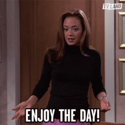 Woman Says Enjoy The Day In Front Of Door GIF