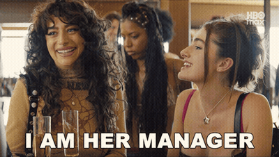 Woman Says I Am Her Manager Holding Champagne Glasses GIF