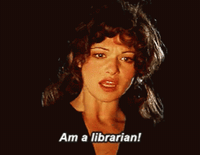 Woman Says I Am Librarian In Dark Room GIF