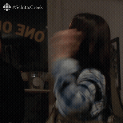 Woman Says I Think My Work Here Is Done In Front Of Schitts Creek Sign GIF