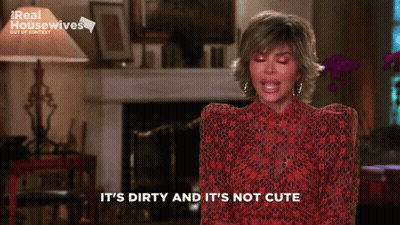 Woman Says It's Dirty And It's Not Cute In Front Of Fireplace GIF