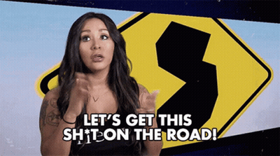Woman Says Let's Get This Shit On The Road In Front Of Sign GIF