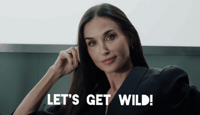 Woman Says Let's Get Wild With Hand On Ear GIF