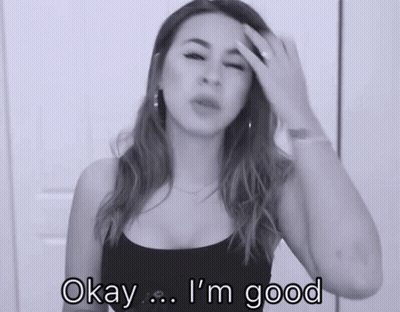 Woman Says Okay I'm Good Holding Her Head GIF