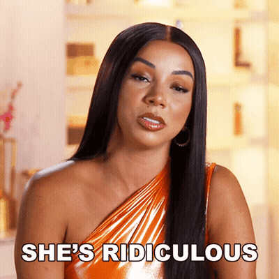 Woman Says She's Ridiculous In Orange One-Shoulder Dress GIF